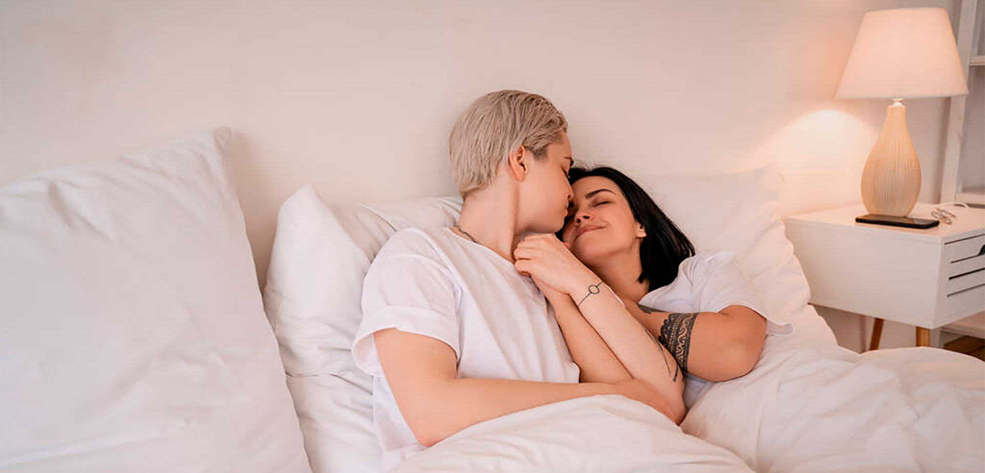 Lesbian Couple In The Bedroom.