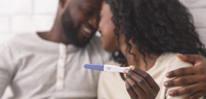Couple with pregnancy test.